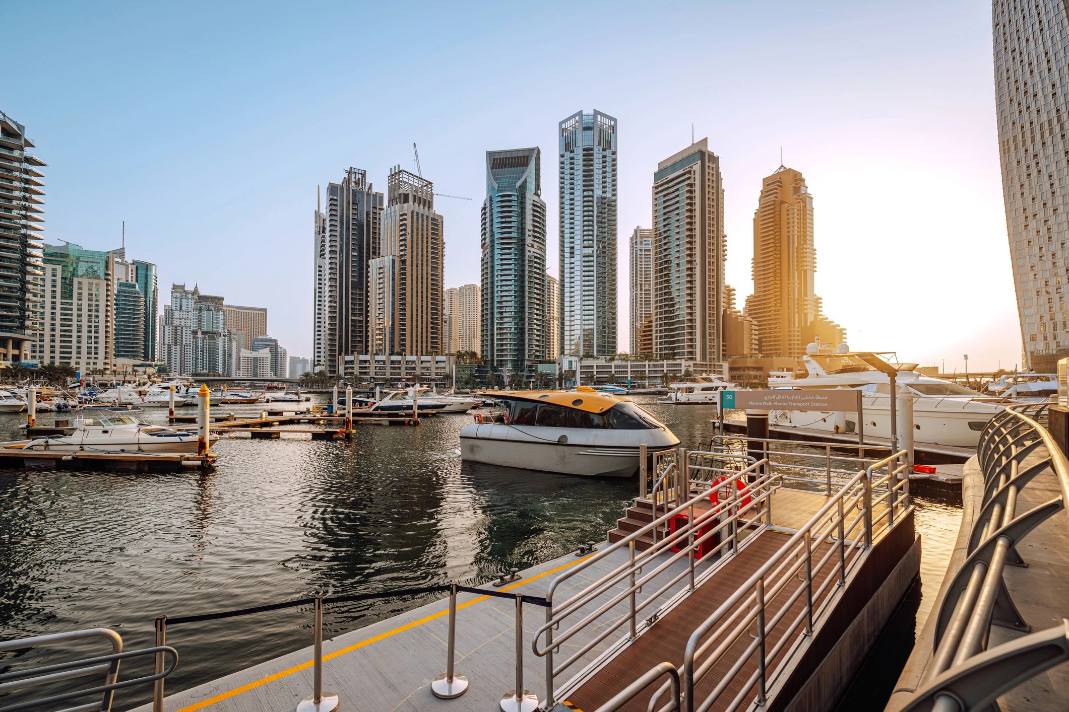 Dubai Marina waterfront with luxury yachts and modern skyline